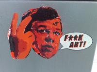 Photo of street art of Brian Cowen saying "F**K ART!"