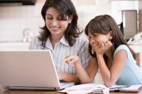 Photo of women & girl on laptop