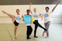 Image of dancers with real Living Wage banner