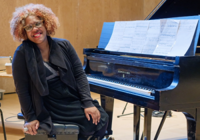 Errollyn Wallen sits at a piano