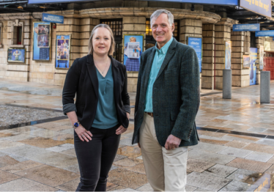 Eleanor Lang and James Williams stand outside the Shaftesbury Theatre