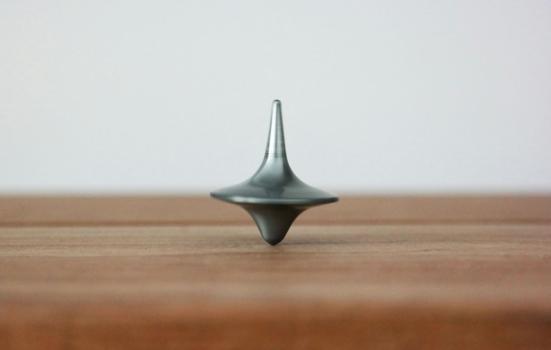 A spinning top on a table