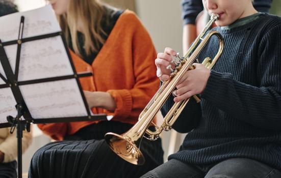 A young trumpet player prepares to play