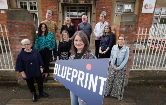 Image showing the Blueprint team with a banner