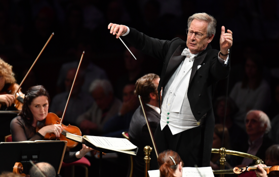 John Eliot Gardiner conducting an orchestra