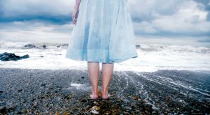 Maes Terfyn (Autumn 07). Female in a blue dress looking out to sea