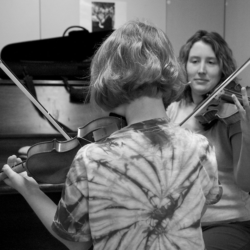 Girl learning violin