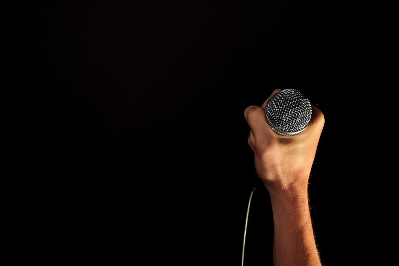 Hand with microphone