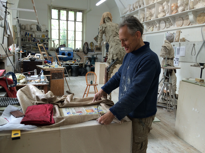 Photo of artist Mark Richard in his studio