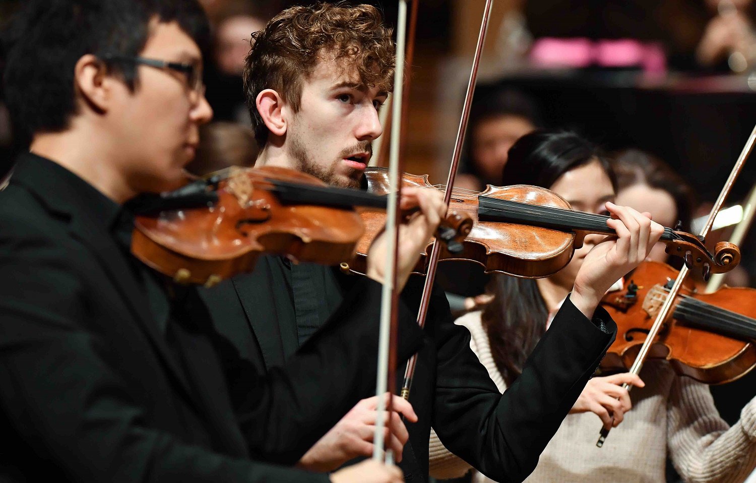 Students playing violines