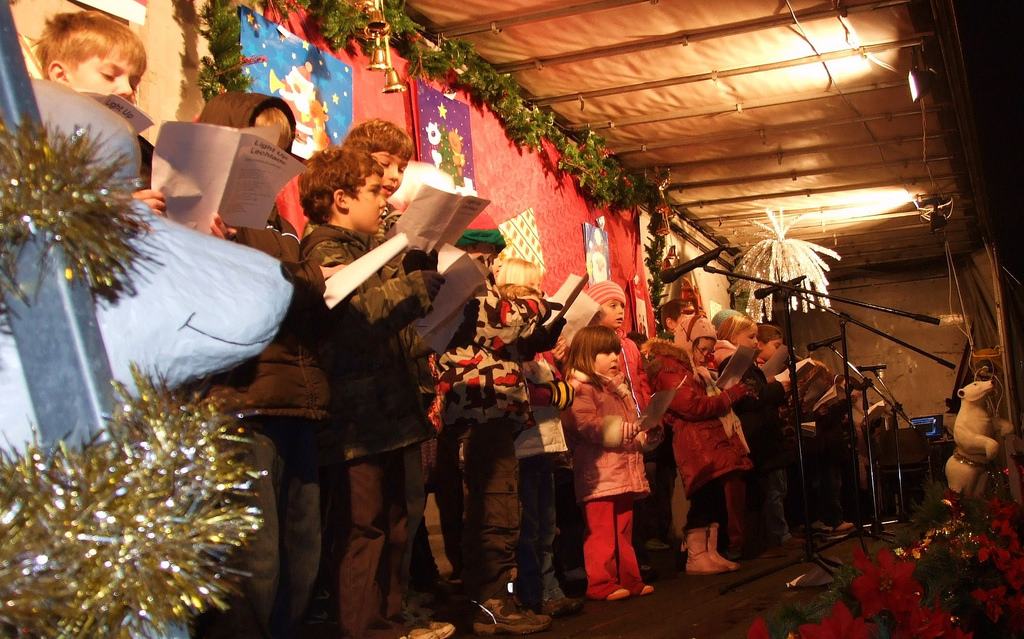 A school choir sings at a Christmas event