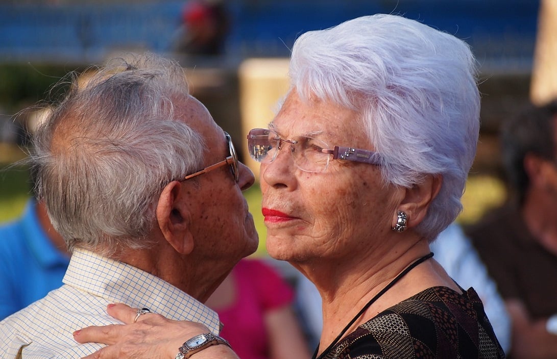 A photo of two older people dancing