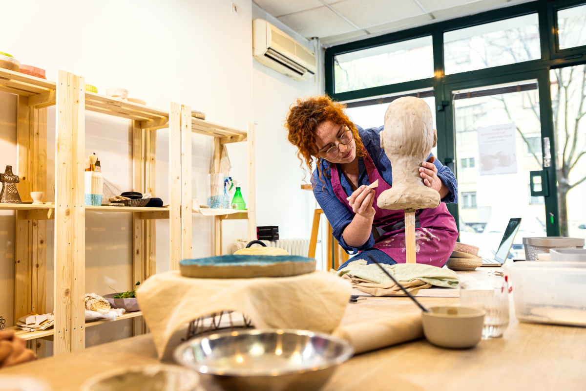 A sculptor working in a studio