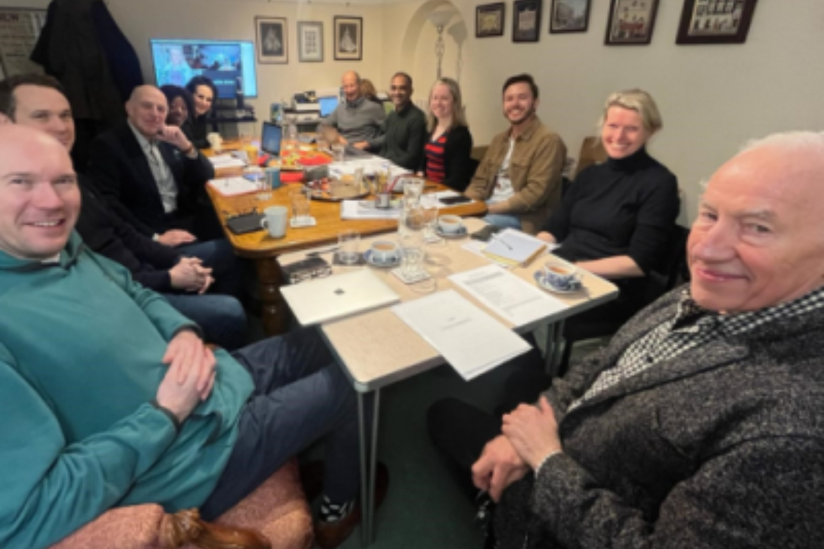 The new board of the Actors' Benevolent Fund sit around a table