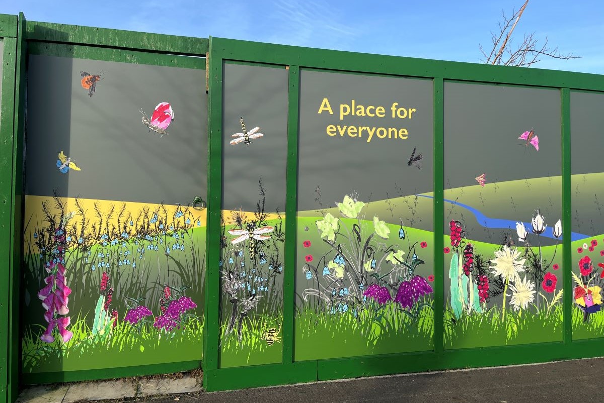 Hoardings with the words 'A place for everyone'