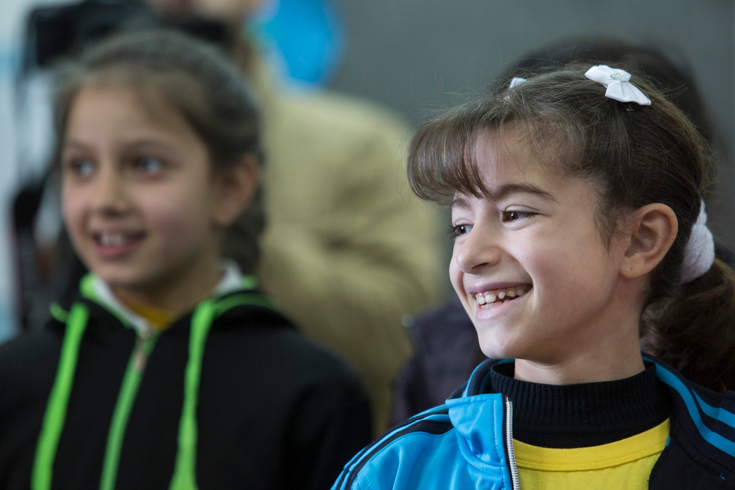 British Council World Voice Palestine Girl with bows smiling