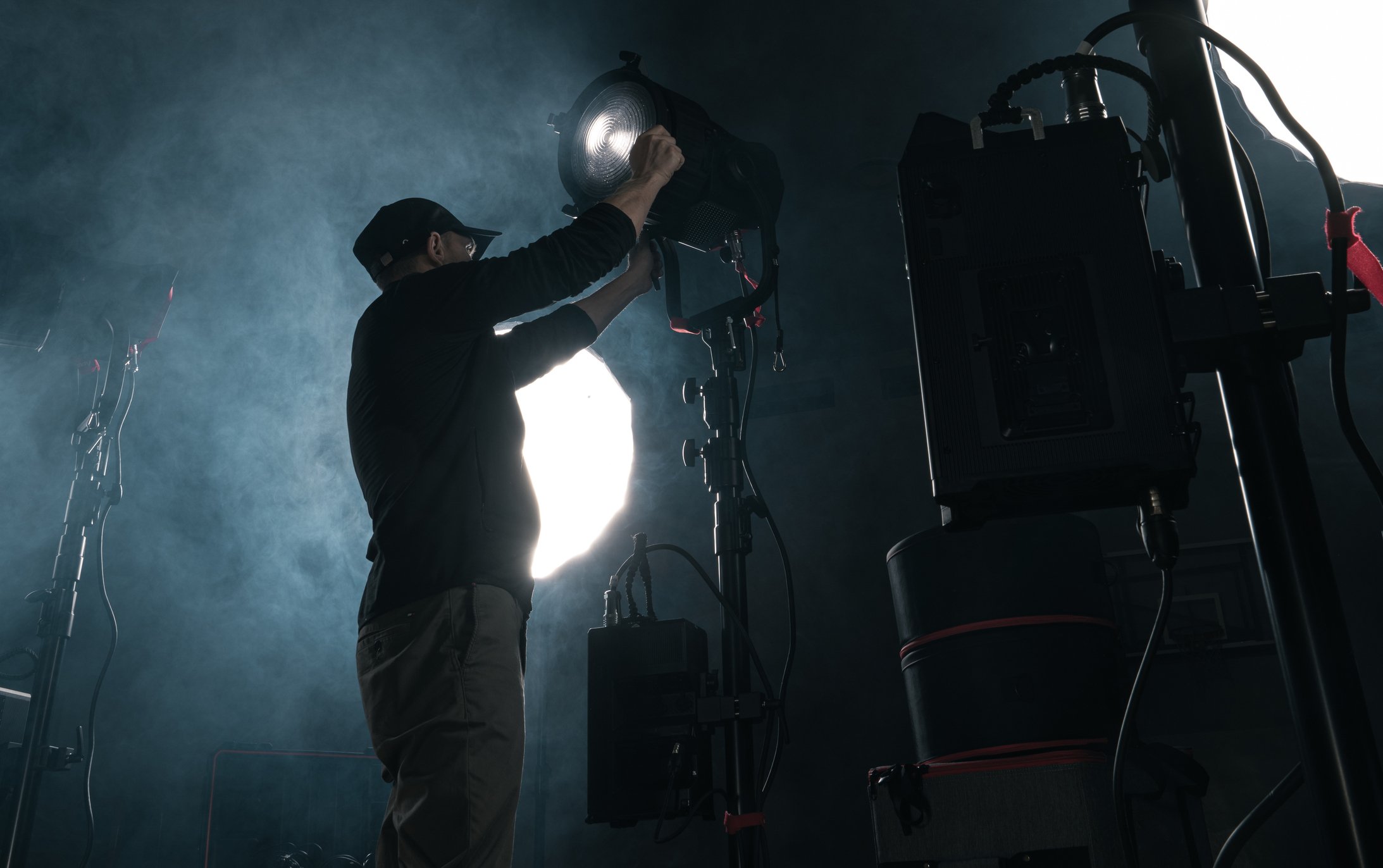 Professional Film Making LED Lighting Assembled by Caucasian Technician in His 40s. Motion Picture Production Theme.