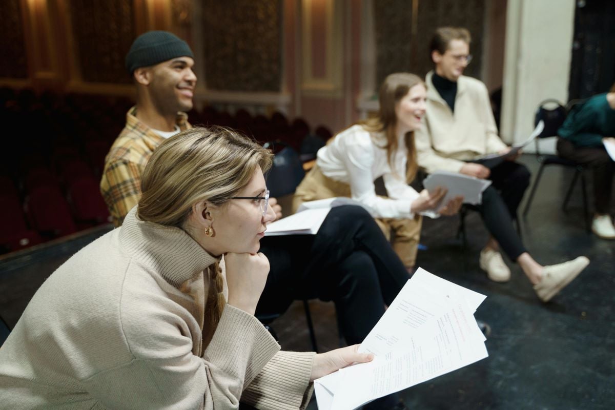 People reading from rehearsal notes