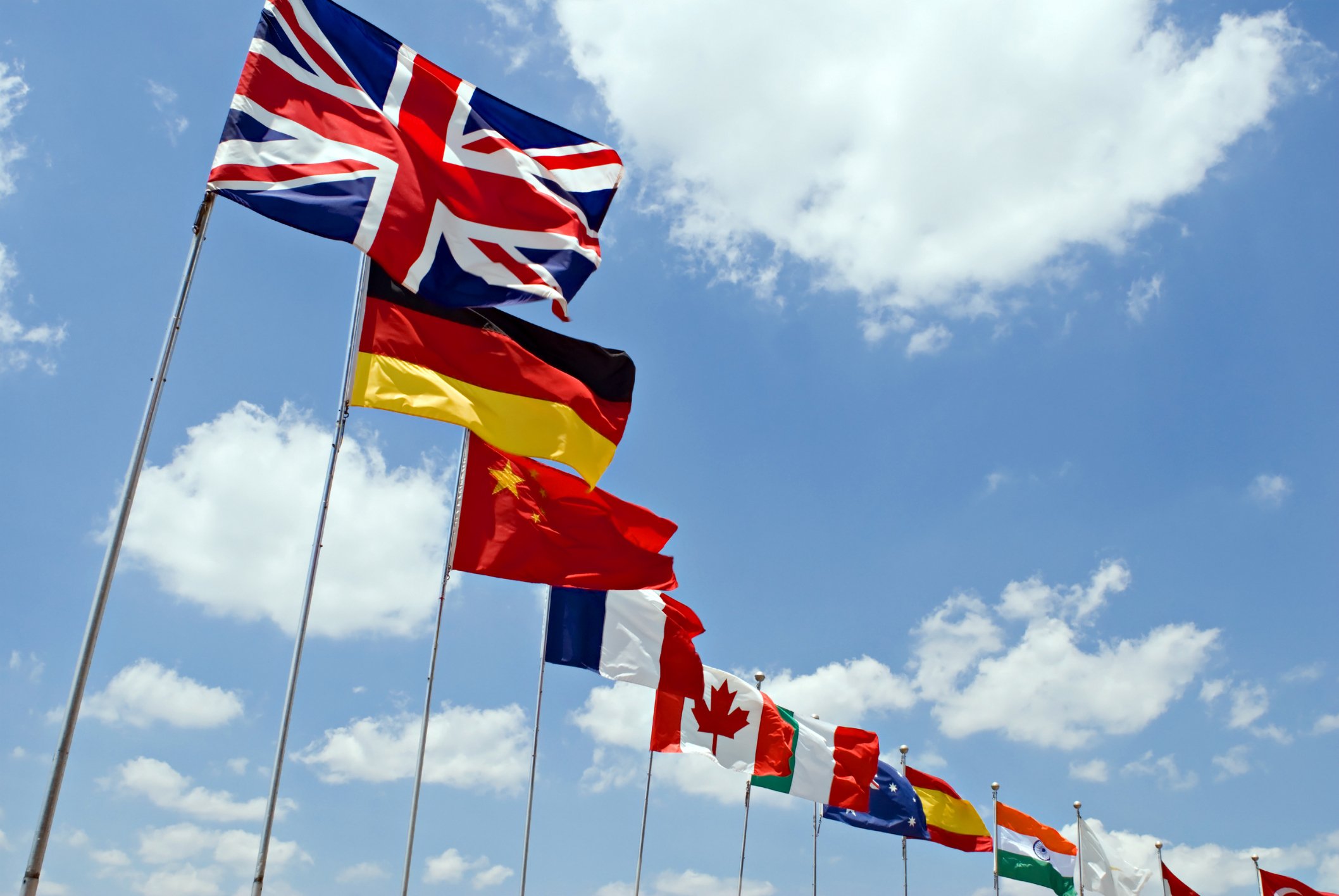 a line of international flags with Union Jack at the front