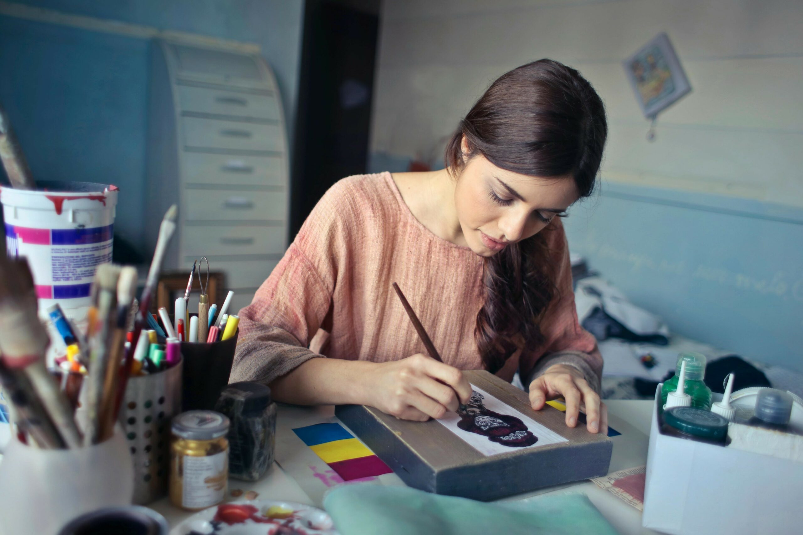 Female artist working in a studio. Photo: Andrea Piacquadio